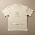 Sutra Rituals Logo Tee – ivory oversized cotton t-shirt with gold Sanskrit emblem at chest