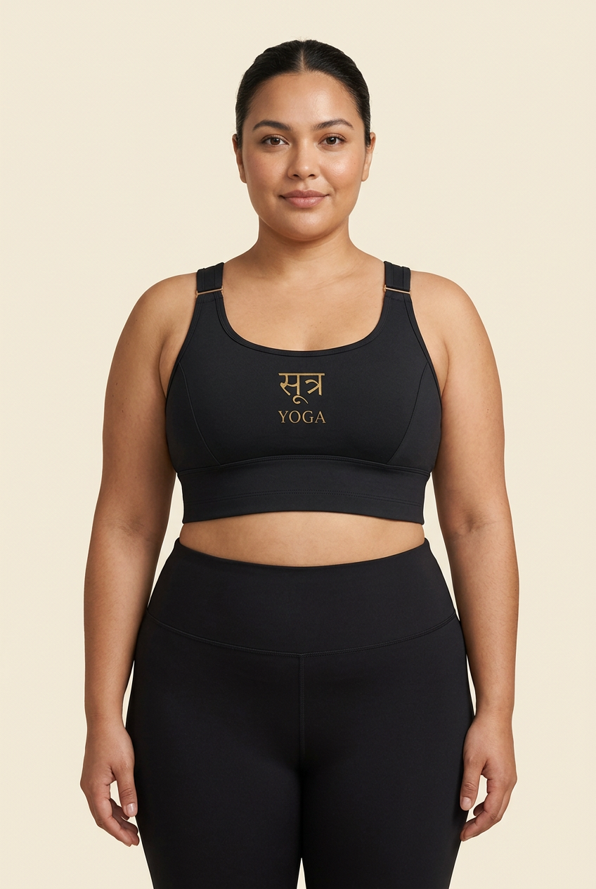 Plus-size model wearing black Sutra bra and leggings
